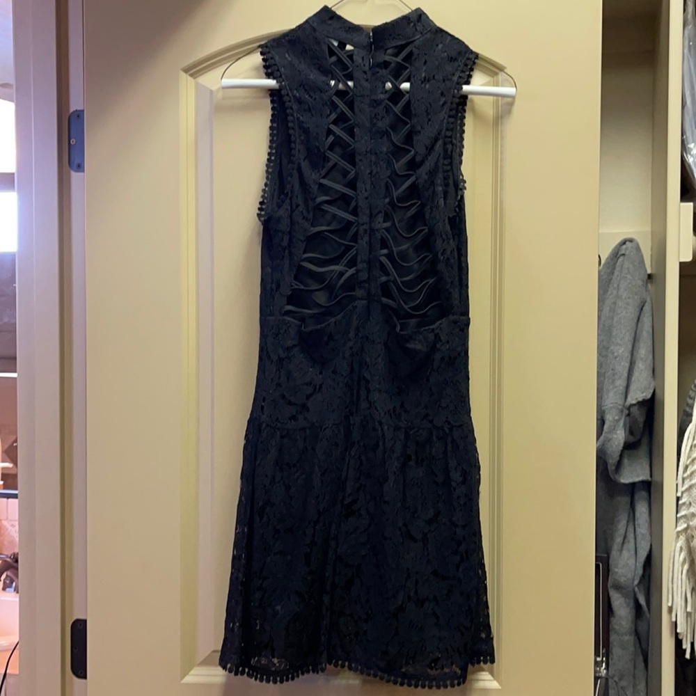 Lace up back lace dress with ruffled style skirt